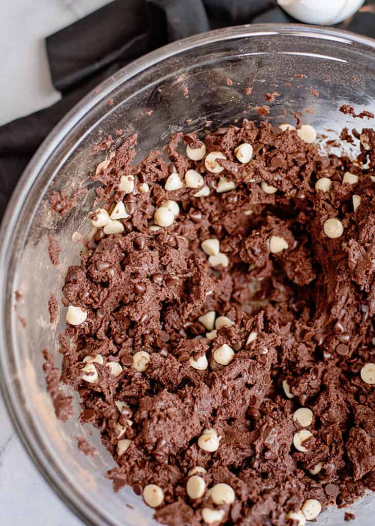 upclose image of the chocolate cookie dough in a glass bowl
